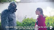 Little Red Riding Hood lost a fruit from her basket and is looking for it in the wolf's pants.