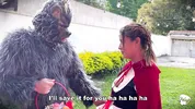 Little Red Riding Hood lost a fruit from her basket and is looking for it in the wolf's pants.