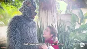 Little Red Riding Hood lost a fruit from her basket and is looking for it in the wolf's pants.